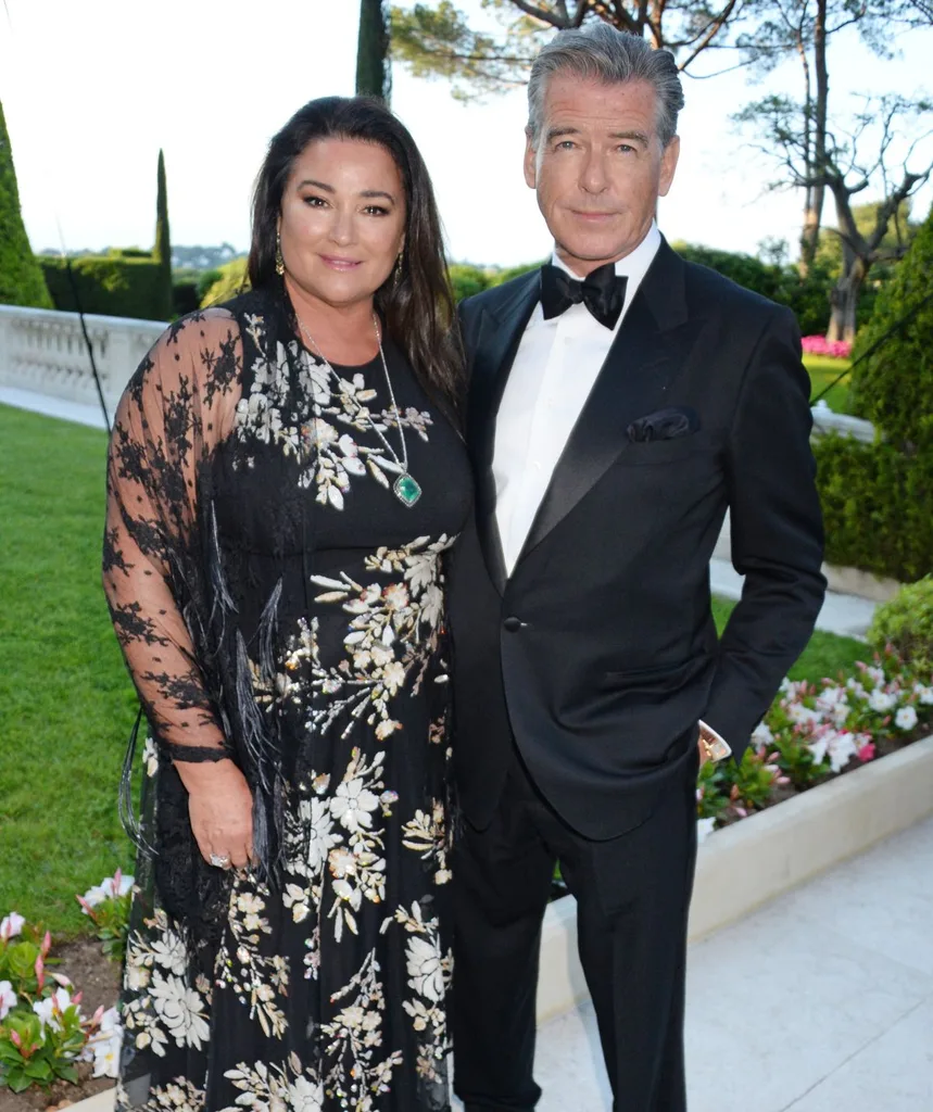 Pierce and Keely stand dressed up outside