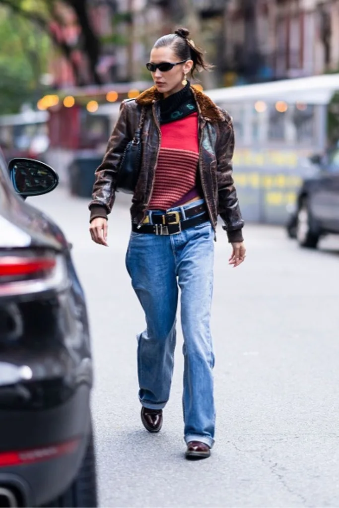 Bella Hadid wearing the double belted trend with her casual jeans and leather jacket on the streets of New York City.