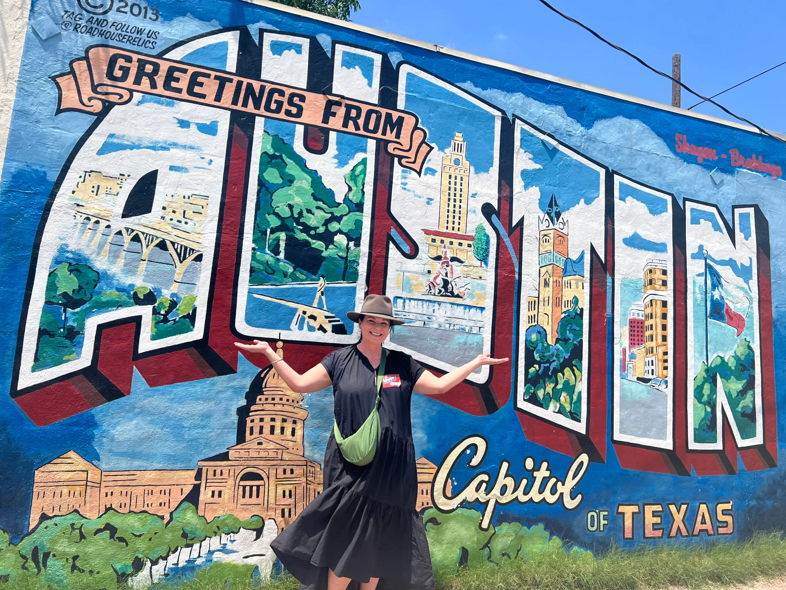 woman in front of Austin mural