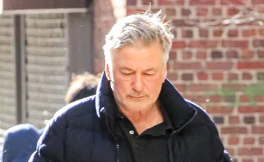 Alec Baldwin looks down, seemingly upset