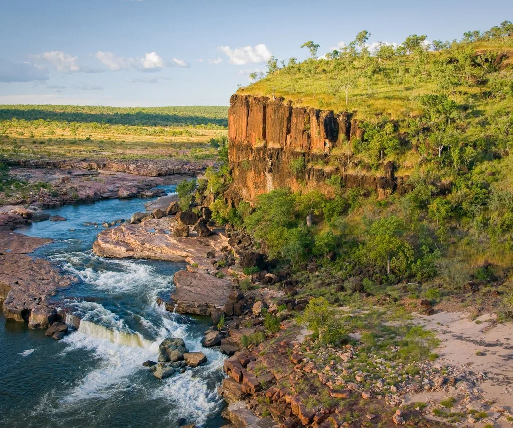 Beautiful Australia landscape with a blue river and cliff with green trees