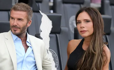 torn image of the Beckhams sitting beside each other