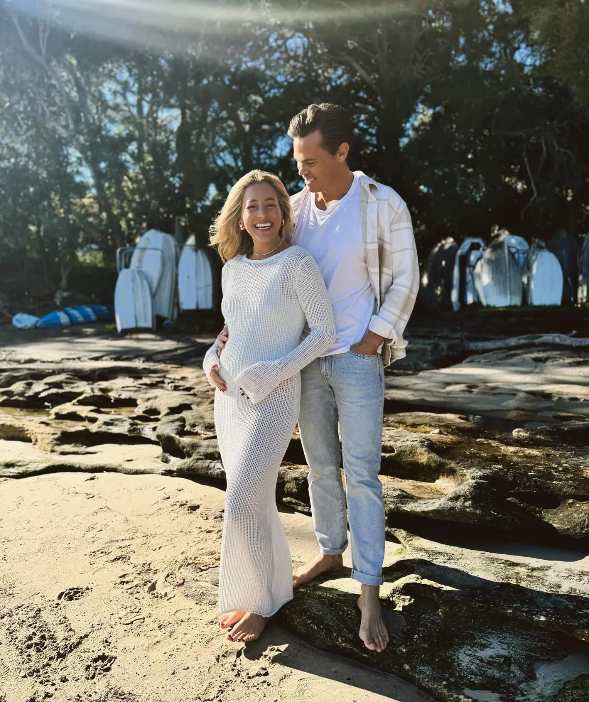 Holly Kingston wears a white crochet dress to show off her growing bump with Jimmy. 