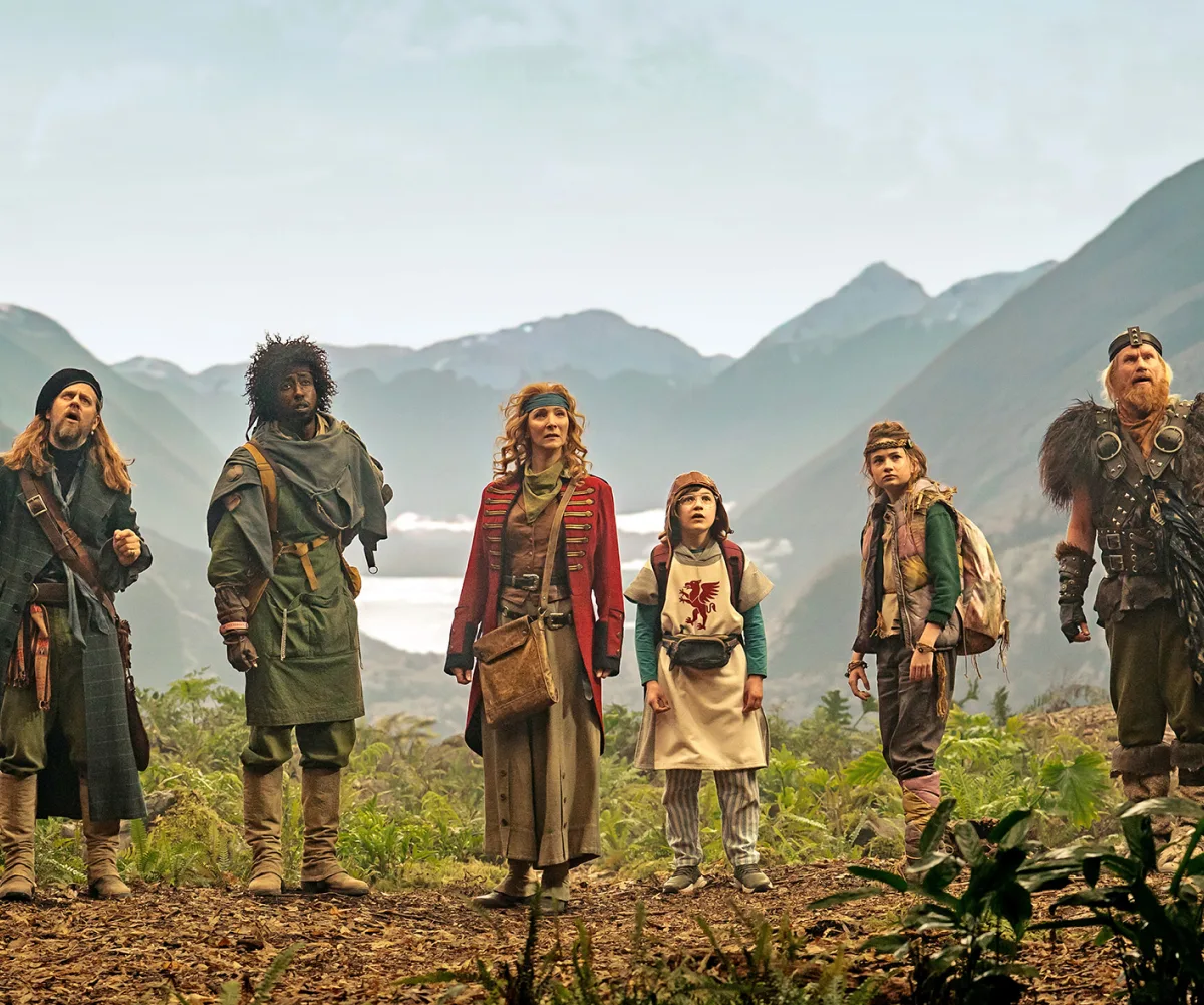 A group of rag-tag time travelling thieves with misty mountains in the background