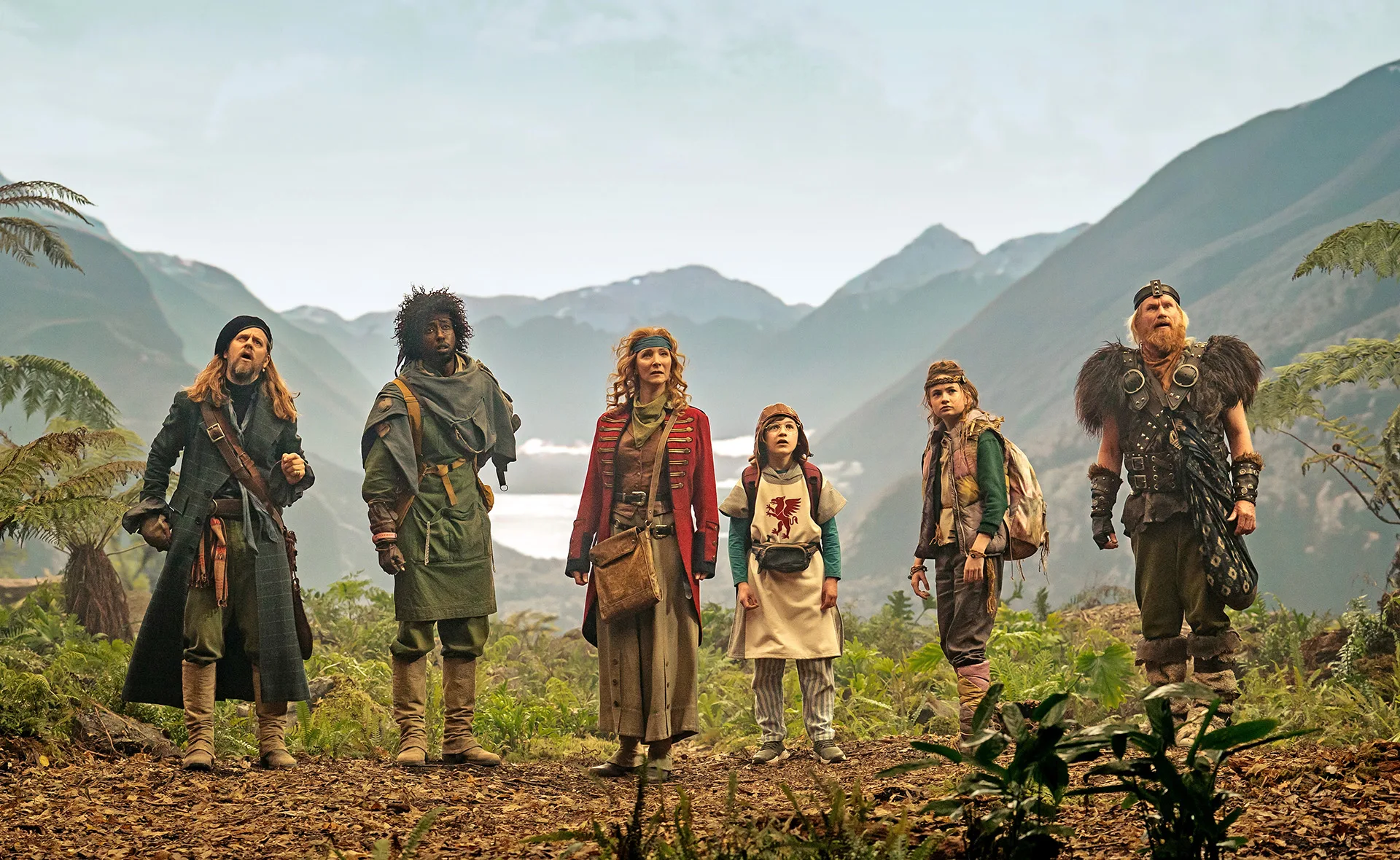 Time Bandits, a group of ragtag time travelling thieves on a mission pictured against a misty mountain range.