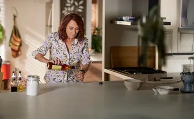 Irene turns to her secret stash of whiskey under the sink and pours herself a big glass