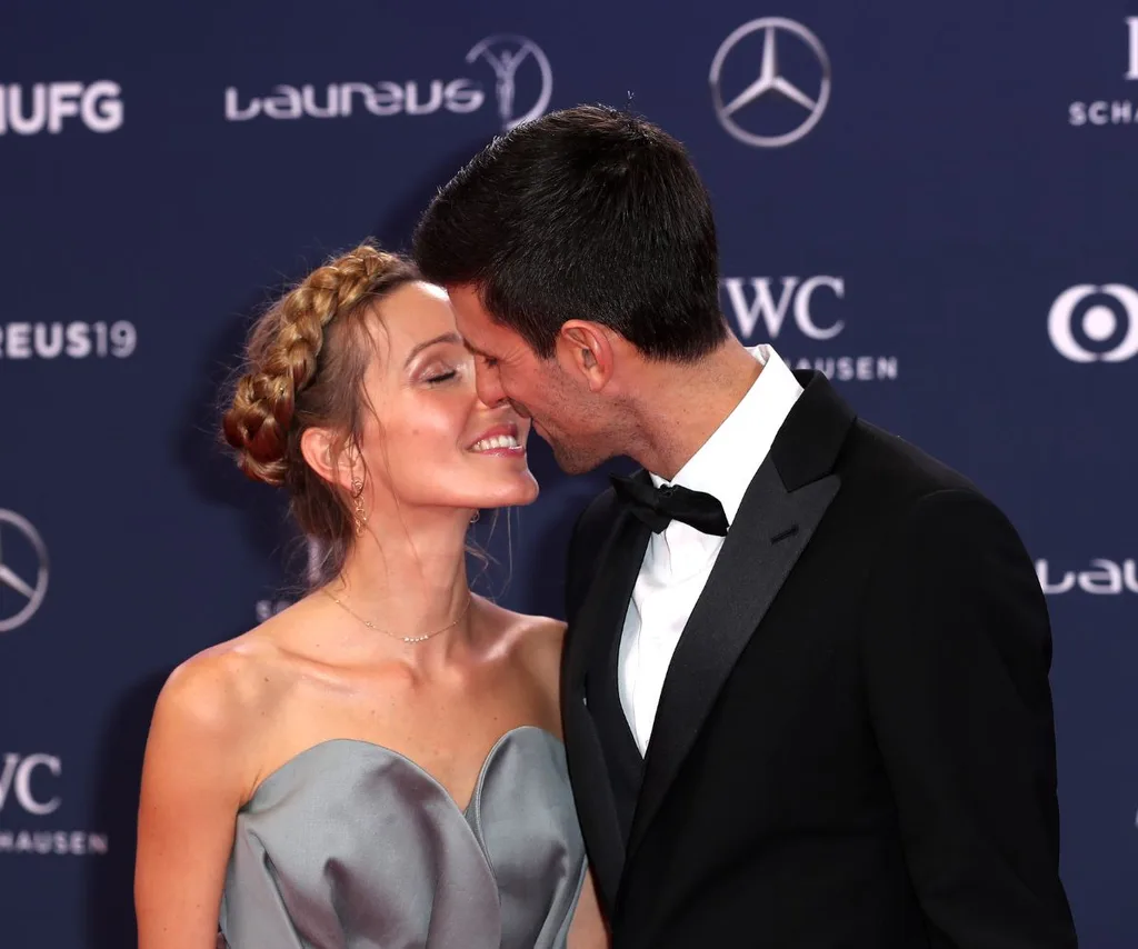 Novak Djokovic kissing his wife Jelena.