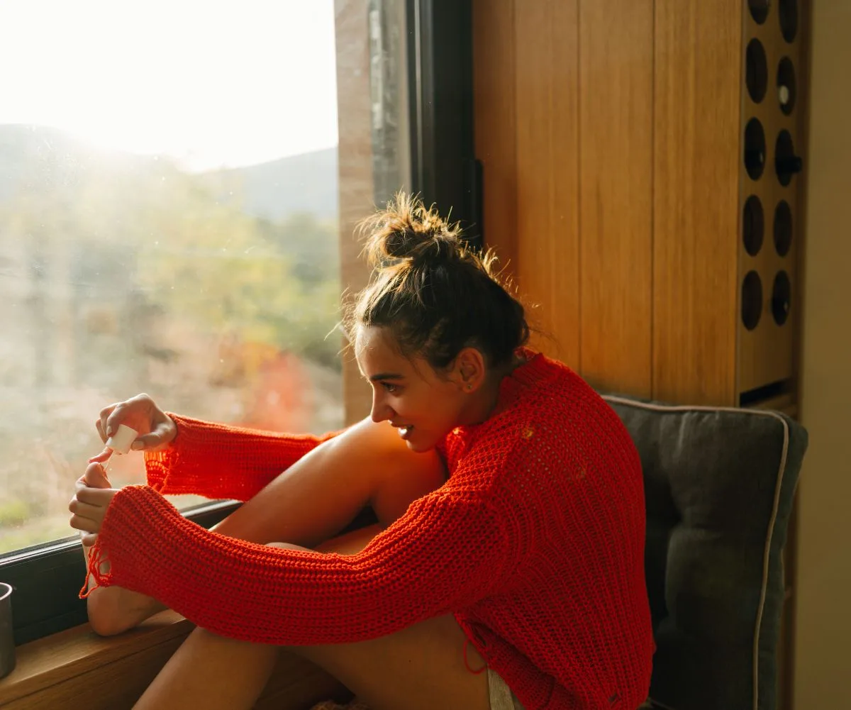 woman painting ails at home