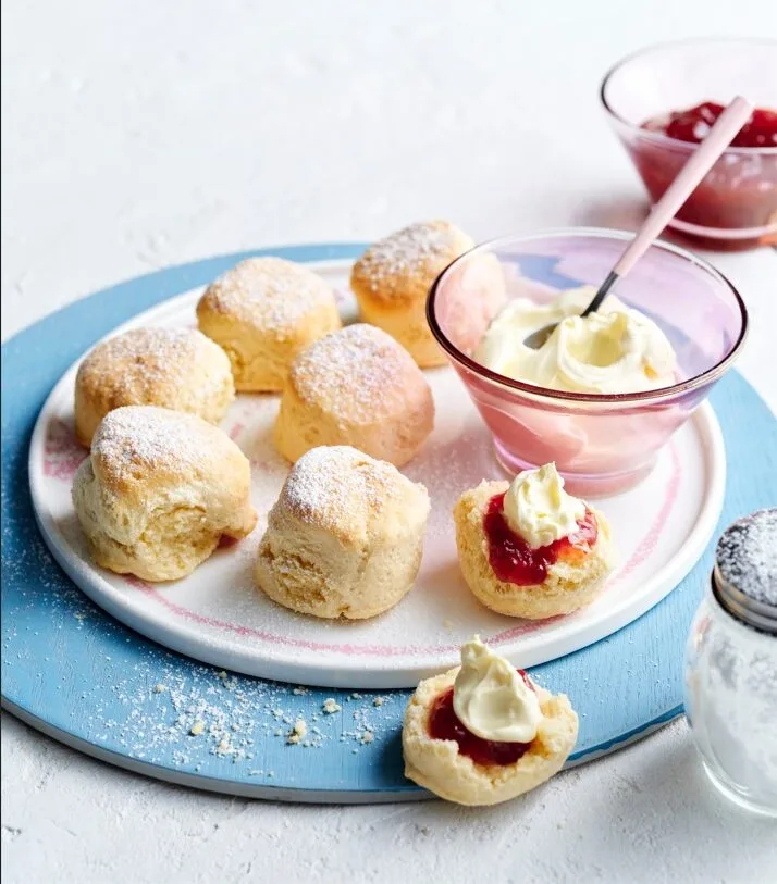 Delicious air fryer scone slathered in jam and cream