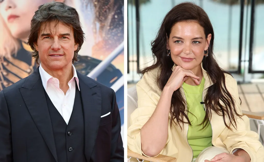 Tom Cruise looking into camera and Katie Holmes looking with a sly grin and hand under her chin