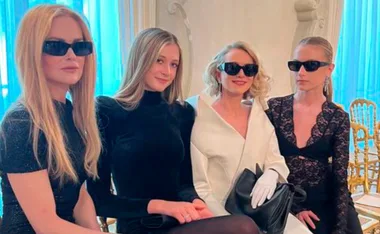 Nicole Kidman, Sunday Rose, Naomi Watts and Kai sit wearing black and white and sunnies for fashion week