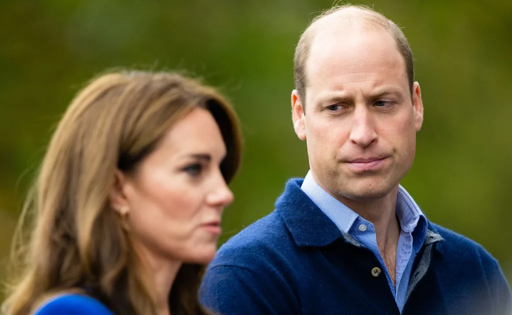 Prince William looks upset as he looks at Kate.