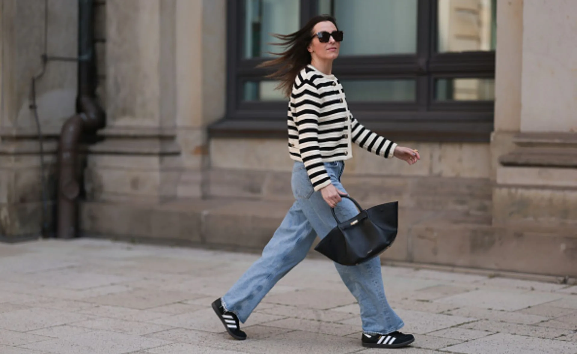 woman walking wearing sneakers