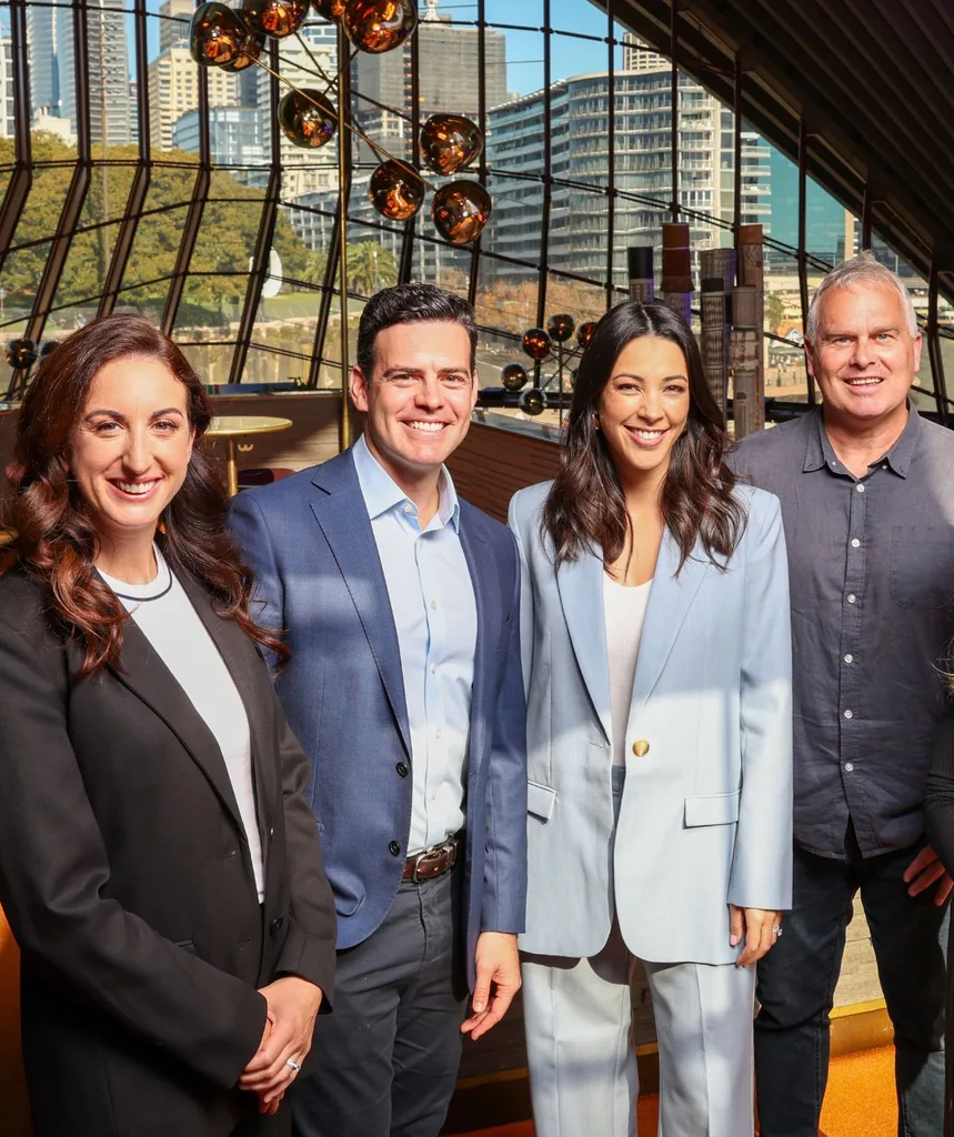 Channel 9 reporters for Olympic games stand together. 