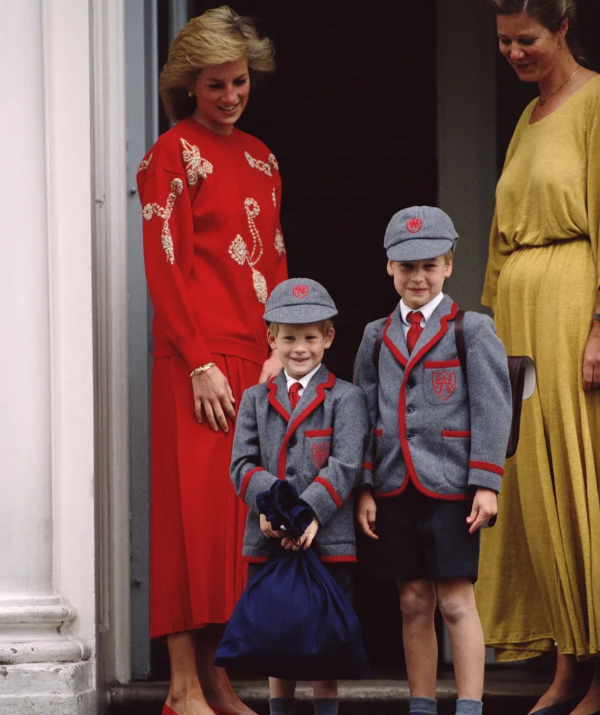 Prince Harry with his mum Princess Diana and brother Prince William on his first day of school. (Image: Getty)