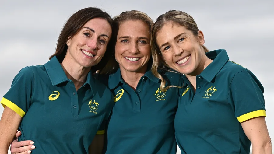 Marathon runners Sinead Diver, Genevieve Gregson and Jessica Stenson smiling to camera.