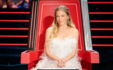 LeAnn sits in the famous spinning red chair from The Voice Australia