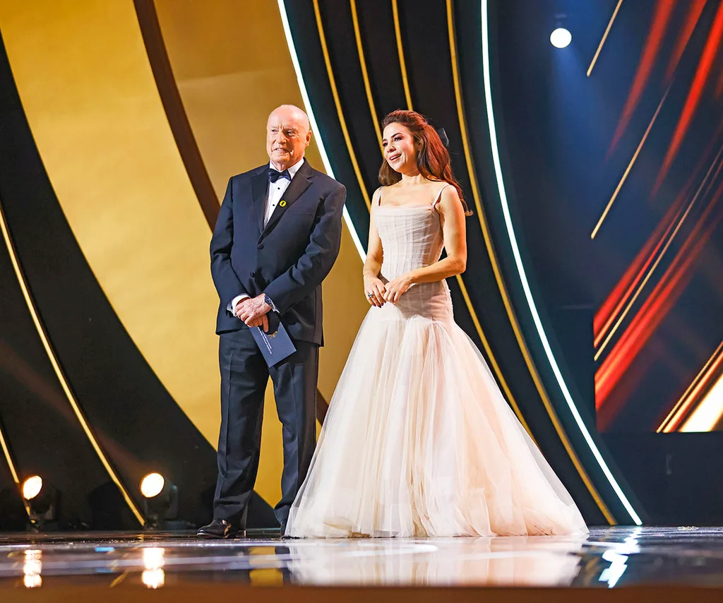 Ray Meagher and Kate Ritchie take to the stage to present at the 64th Logie Awards at The Star in Sydney