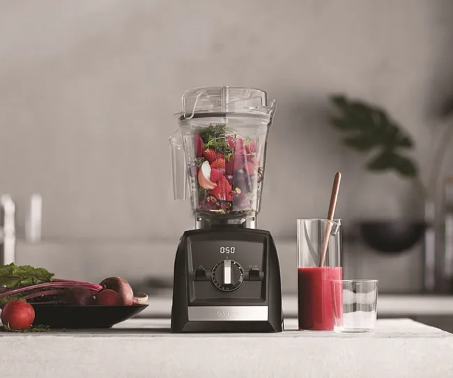 vitamix blender with fruit in it