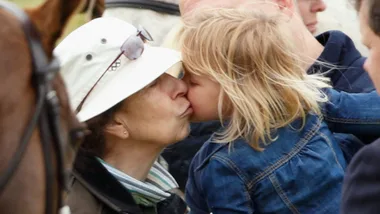 princess anne gives young blonde granddaughter kiss on the cheek