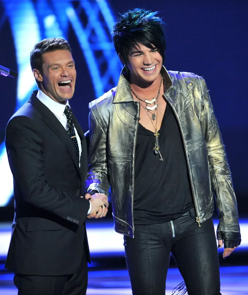 Ryan Seacrest and Adam Lambert happy on stage of American Idol