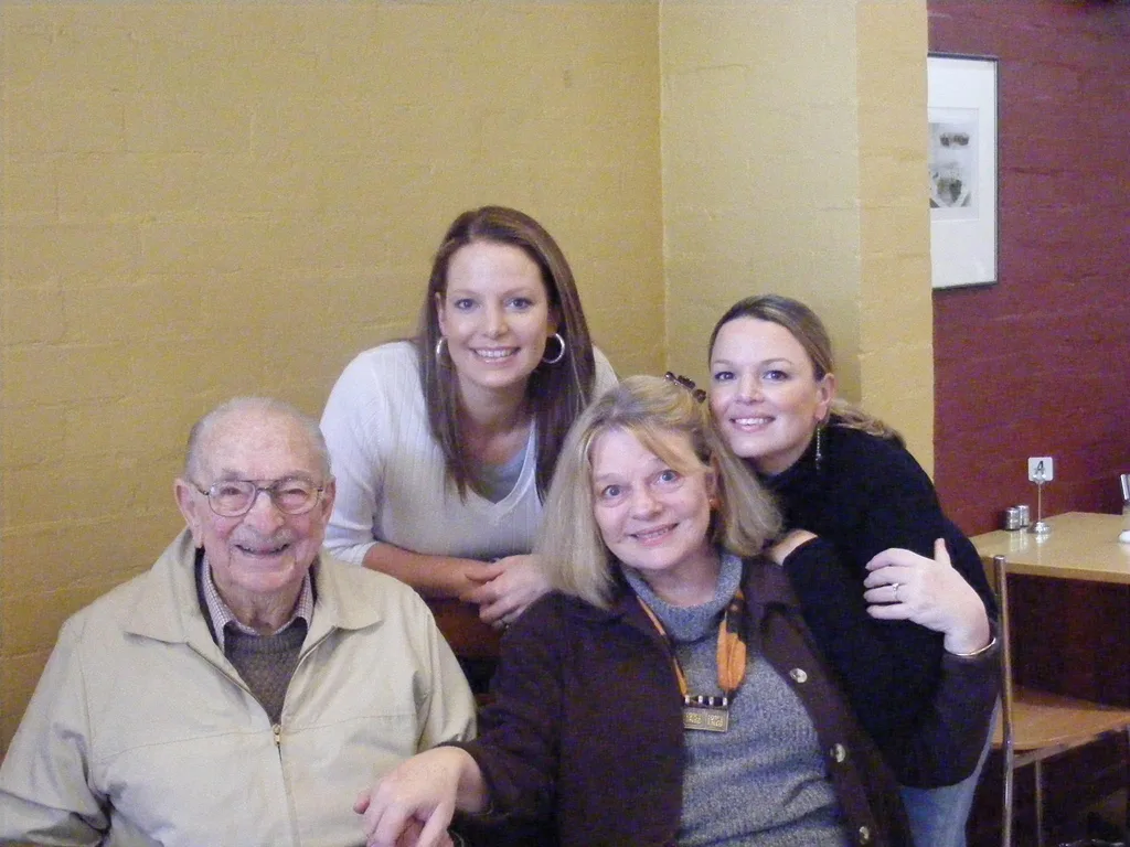 Libby Mitchell with her dad (far left) and her daughters, Christine (left) and Belinda (Right)