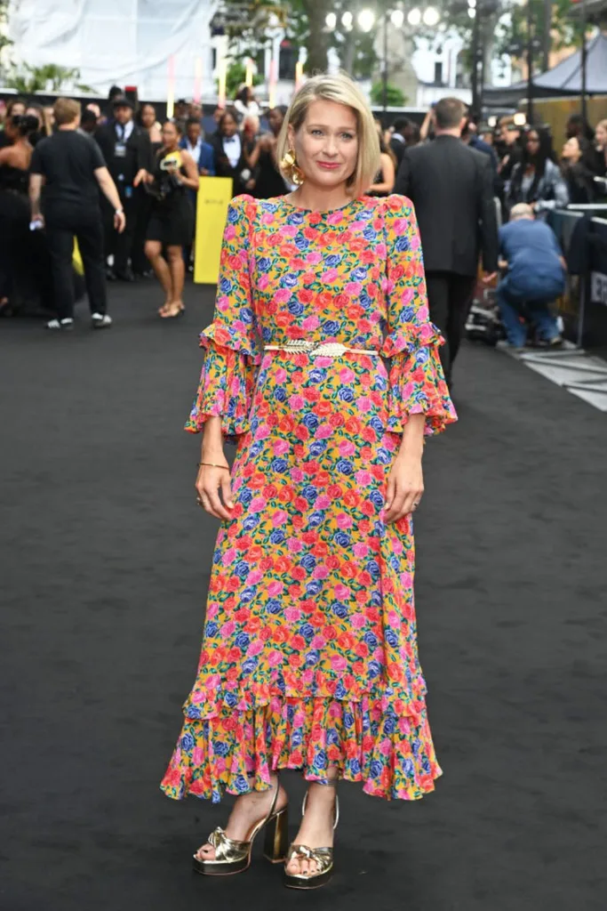 Sian Brooke looking loving in bright coloured floral dress