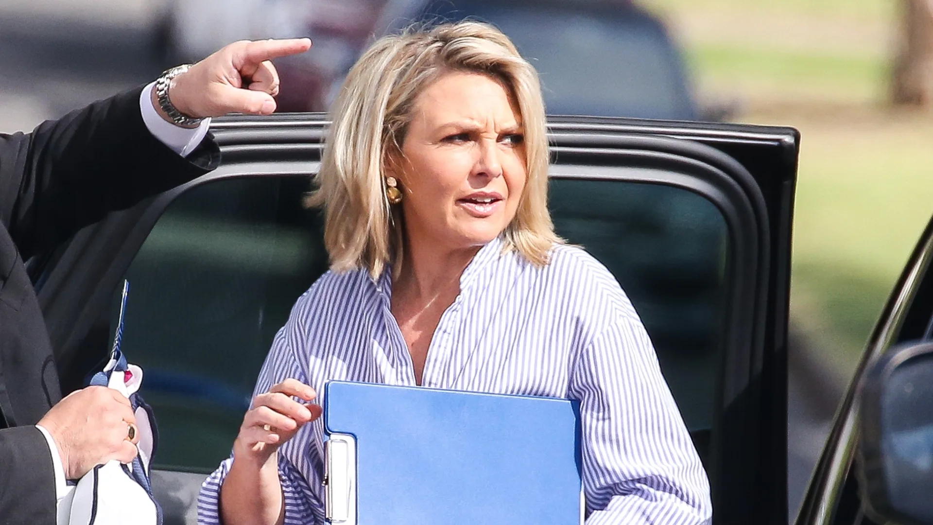 Georgie Gardner holding a clipboard