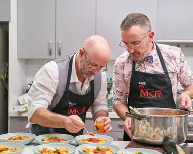 Pete and Mike are plating up food in their kitchen during their instant restaurant.