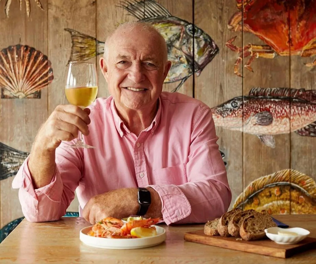 Rick Stein with a glass of wine