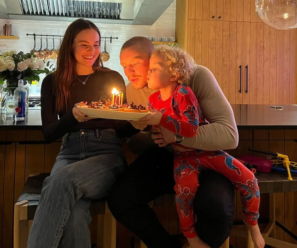 Adam Peaty with son George and partner Holly Ramsay.