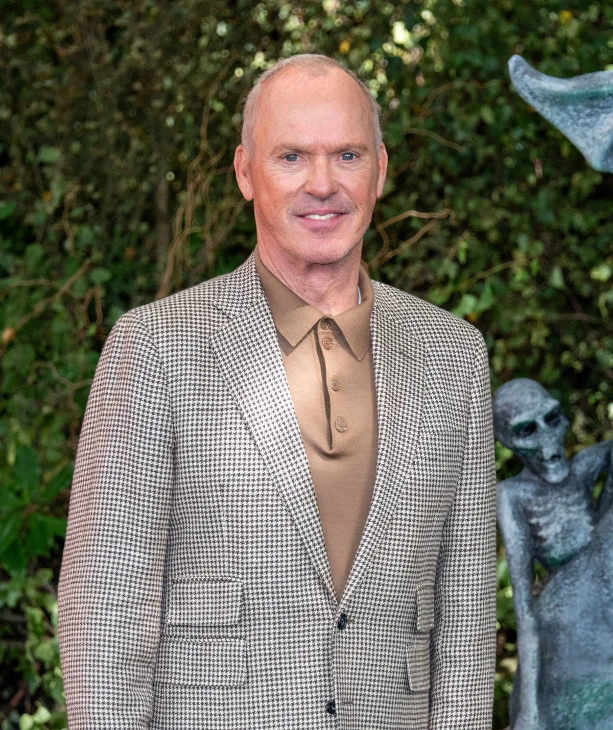 Michael Keaton wearing a suit.