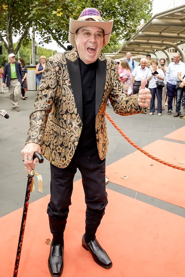 Molly Meldrum using a walking stick