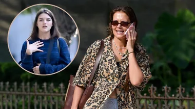 Katie Holmes talking on the phone and Suri Cruise.