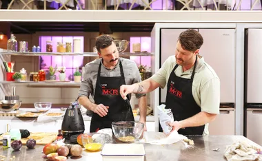 Brothers Liam and Rob are adding ingredients to a bowl at Kitchen HQ,