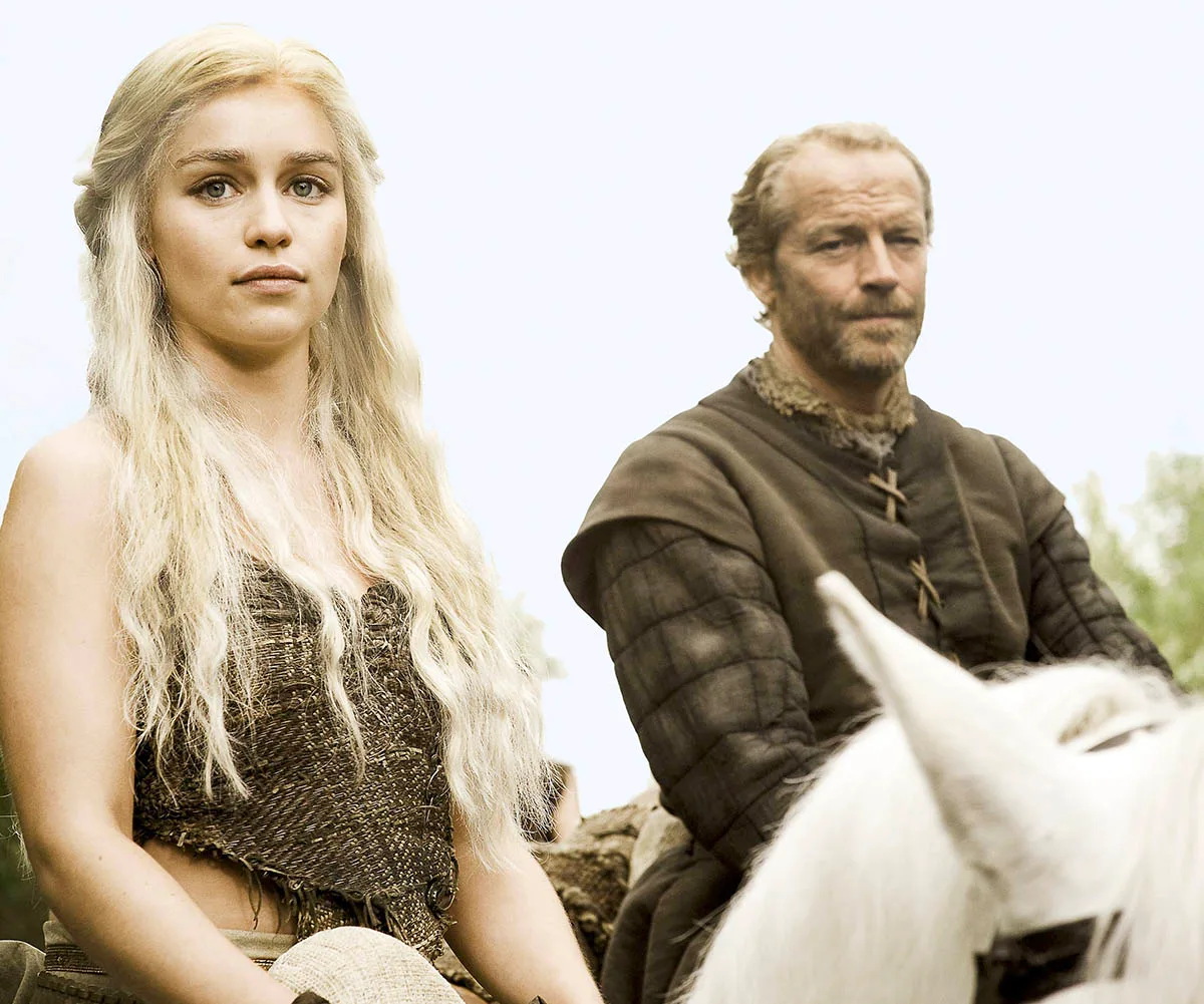 Iain Glen as Ser Jorah Mormont with Emilia Clarke as Daenerys Targaryen in Game Of Thrones.