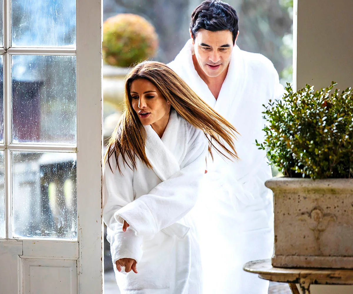 Now dressed in white robes, Leah and Justin make a run for it back to their hotel suite after being caught.