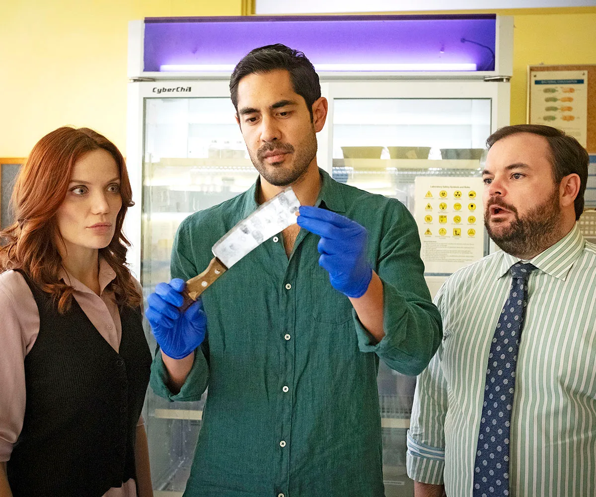 DI Mackenzie Clarke, Glenn and Detective Colin look over evidence in the latest murder in Return to Paradise.