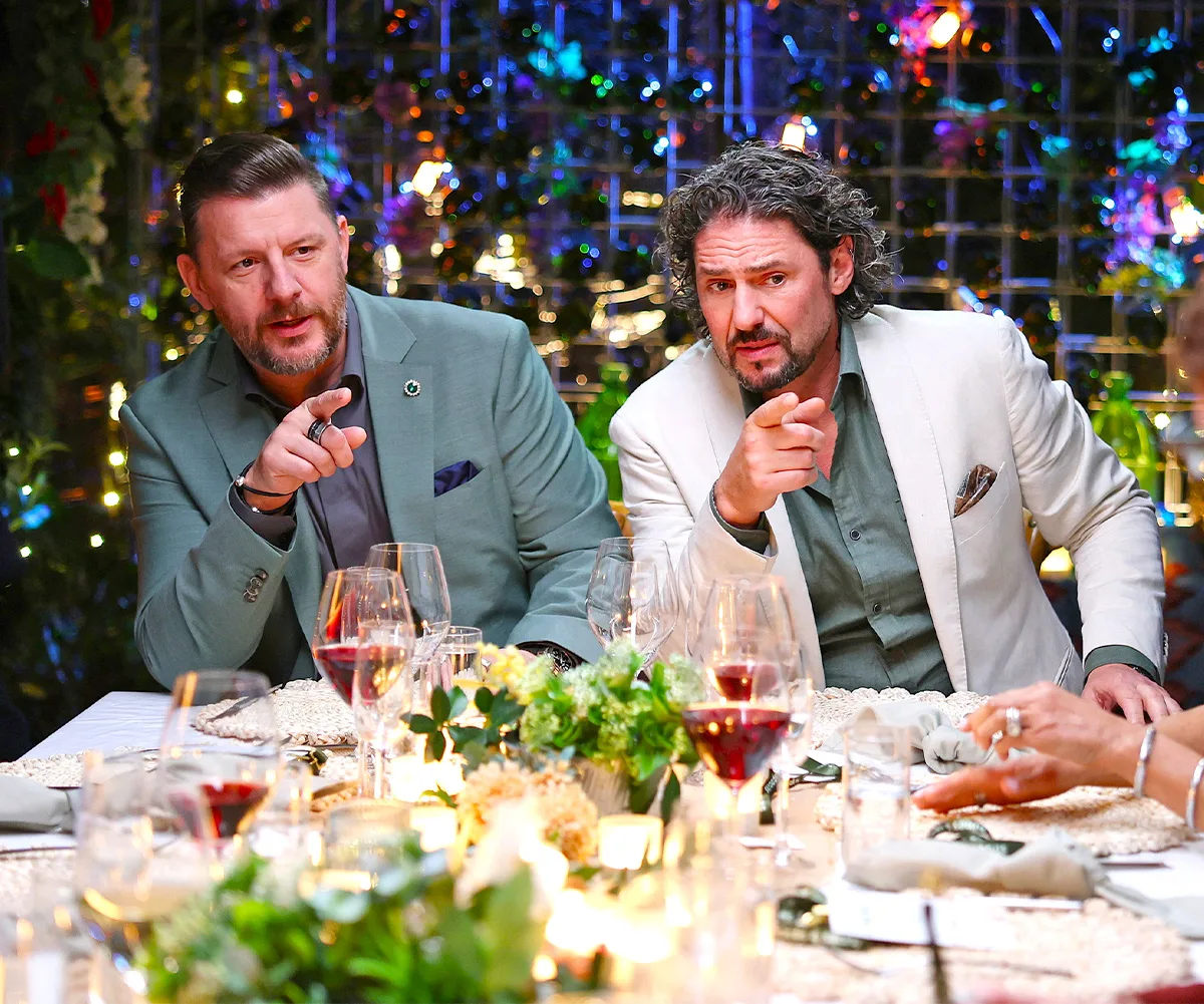 My Kitchen Rules' judges Manu Feildel and Colin Fassnidge point their fingers at the dinner table. 