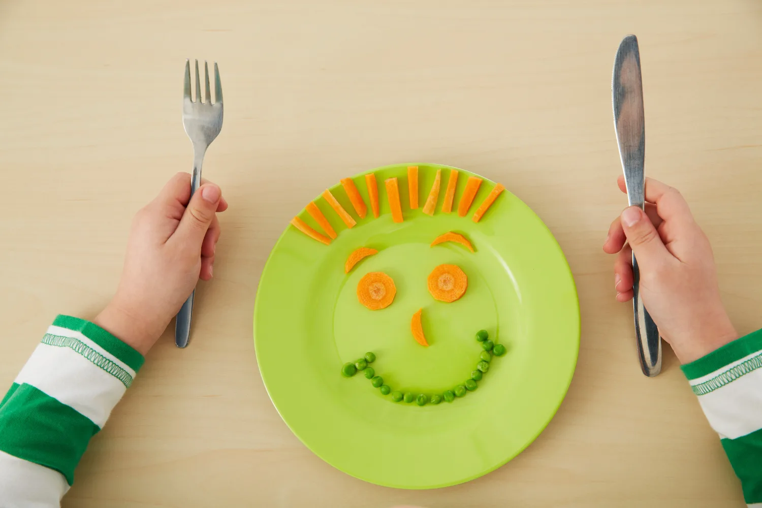 Child's food arranged into face on plate