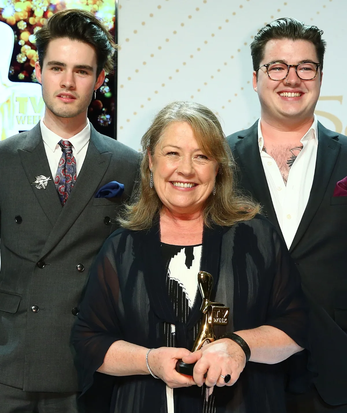 Noni Hazlehurst with her two sons. They are smiling and celebrating her Logie win.