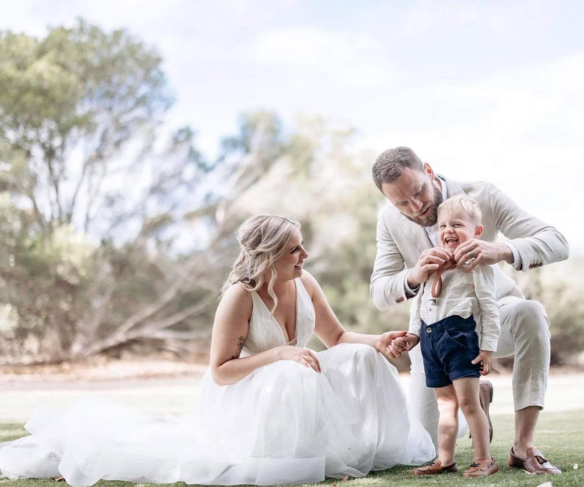 Josh and Skye on their wedding day with little Xander