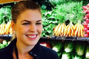 Belle Gibson with fresh fruit in the background