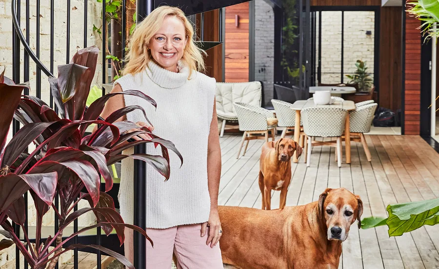 The Block's Shelley Craft stands with her dog at her home.