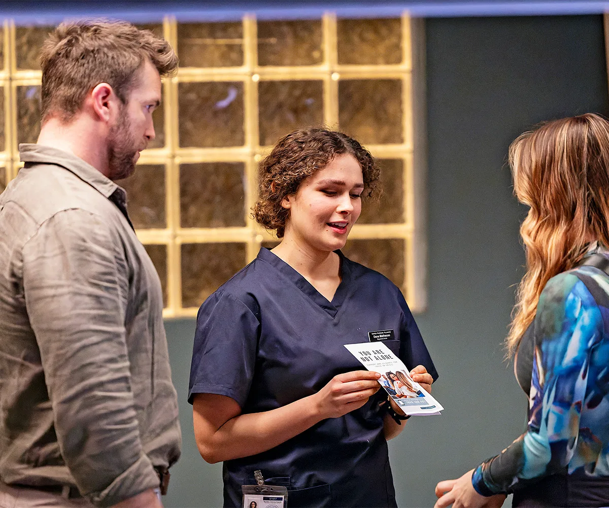 When Abigail is found at the hospiital, Dana (Ally Harris) provides her with brochure that could help her battle her demons.