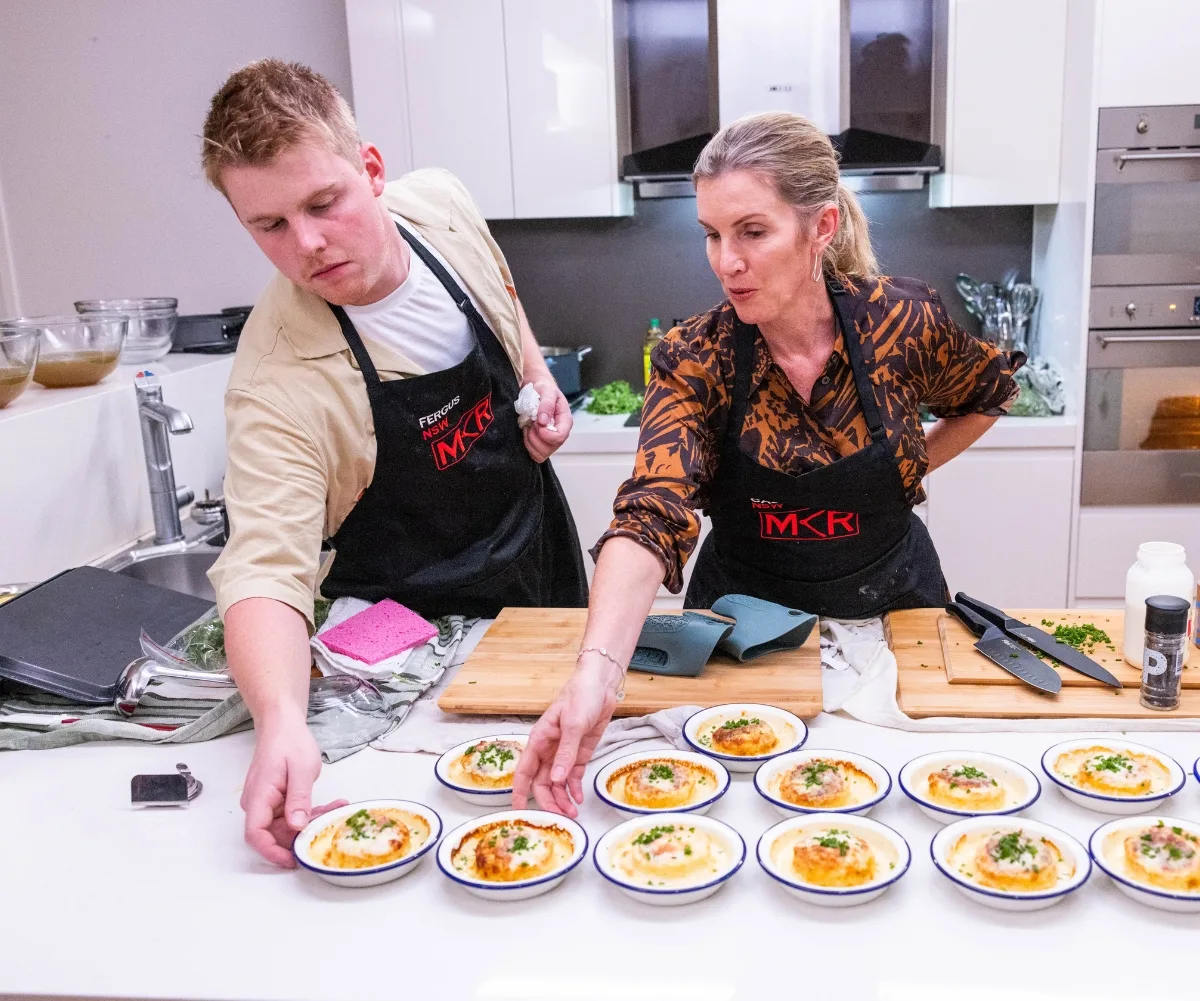 Caz and Fergus cooking in the kitchen together.