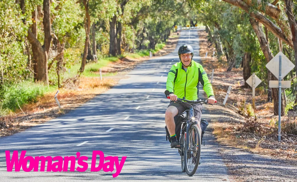 Samuel Johnson riding his bike down a country road.