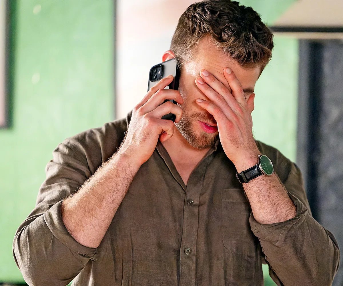 Levi (Tristan Gorey) buries his head in his hands as he receives a phone telling him that Abigail has gone missing.