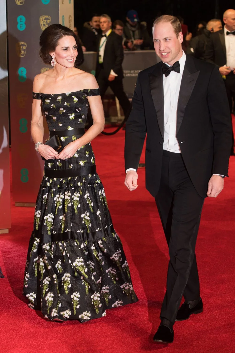 Kate Middleton in black floral dress with Will in tuxedo 