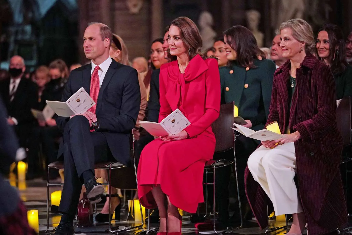 Kate Middleton in red dress with Will in red tie